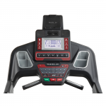 Console screen of the Sole F65 treadmill. The features includes 2 cup holders, multiple button functions, speakers, a mini fan and a tablet holder