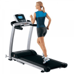 A fit woman in athletic attire running on the Life Fitness F3 Treadmill
